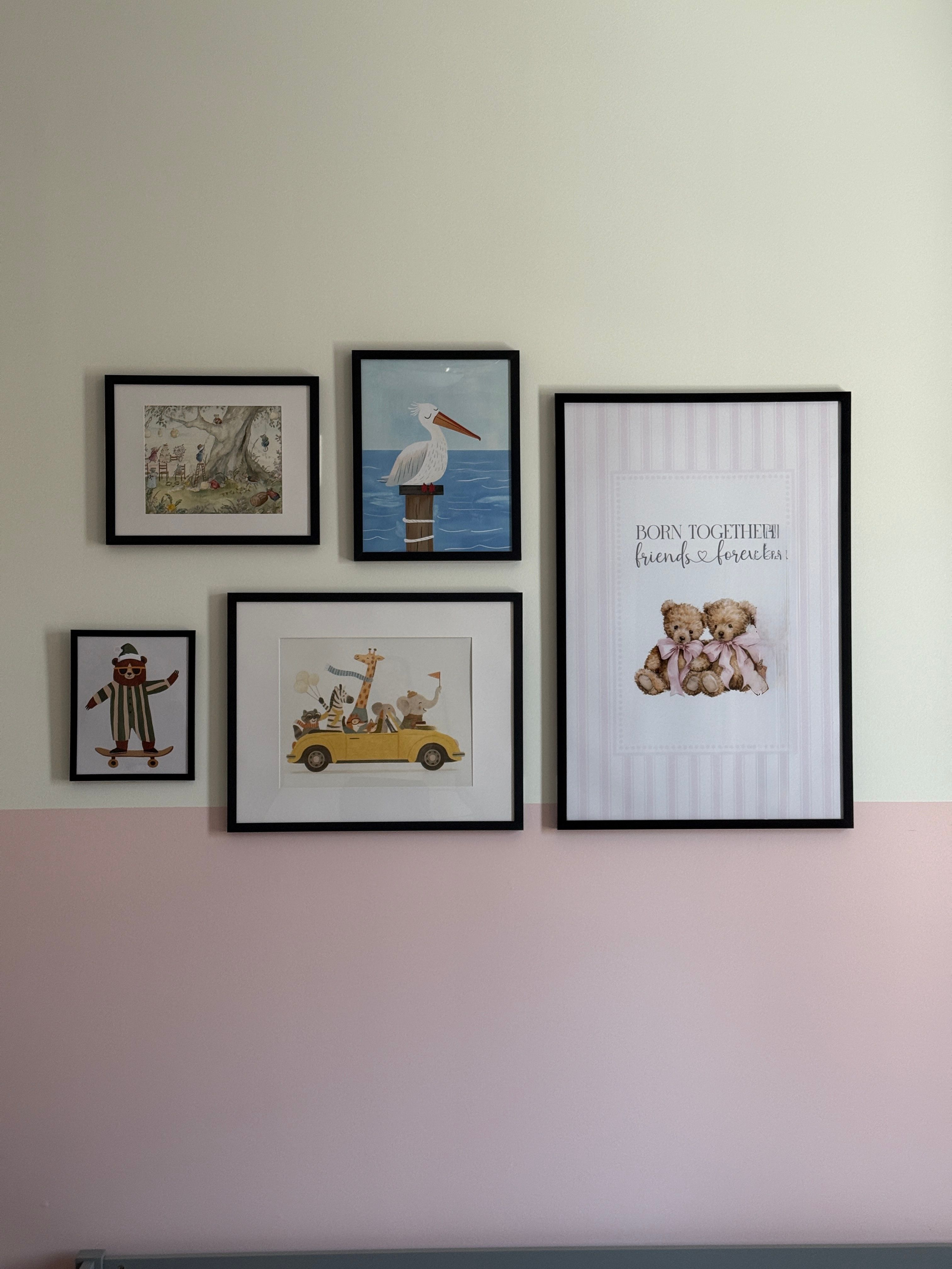 Baby girls nursery gallery wall with two-tone white and pink wall paint styled by Pragya Saikia Design in Aldie, Virginia